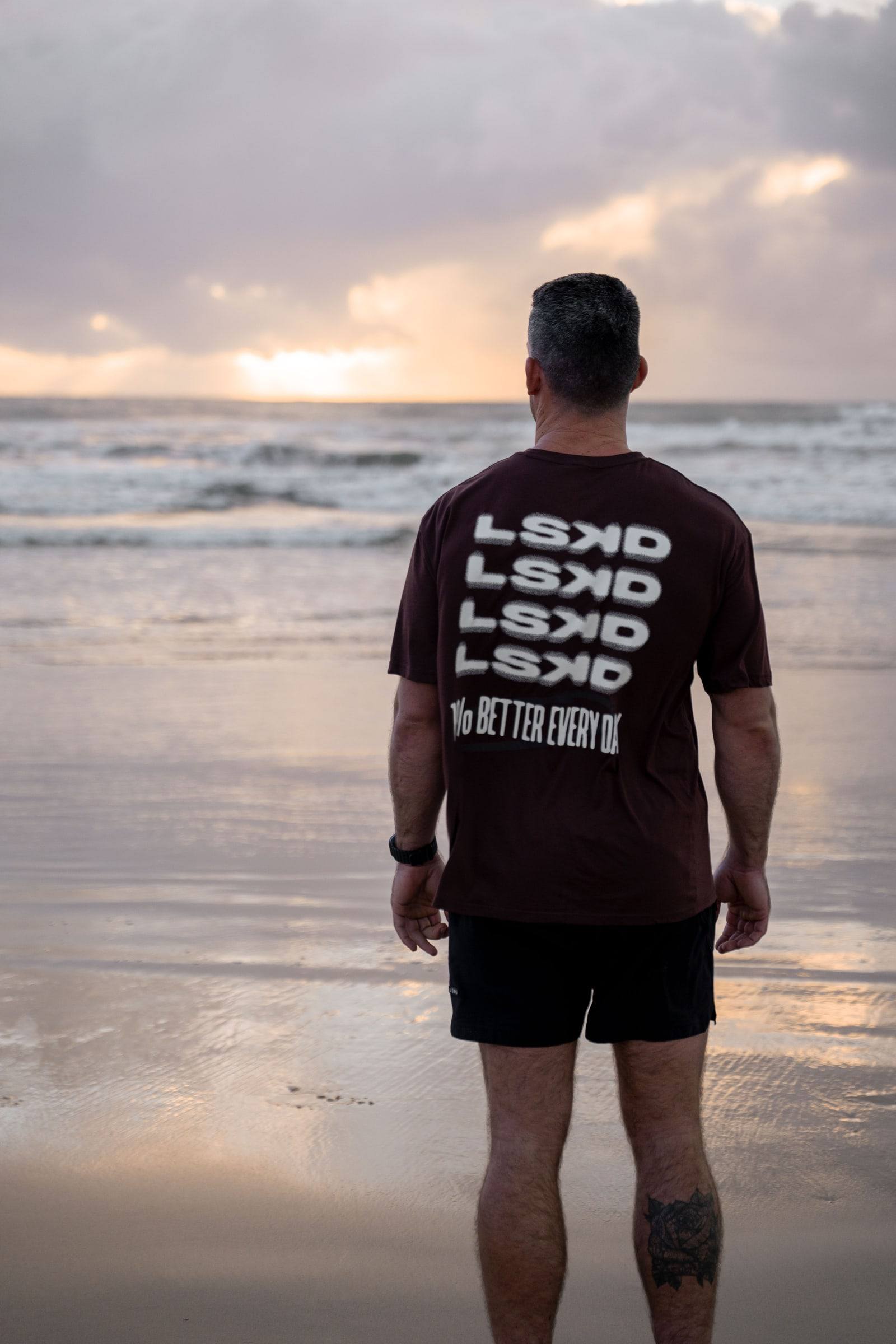 Richy looking out to sea at sunrise