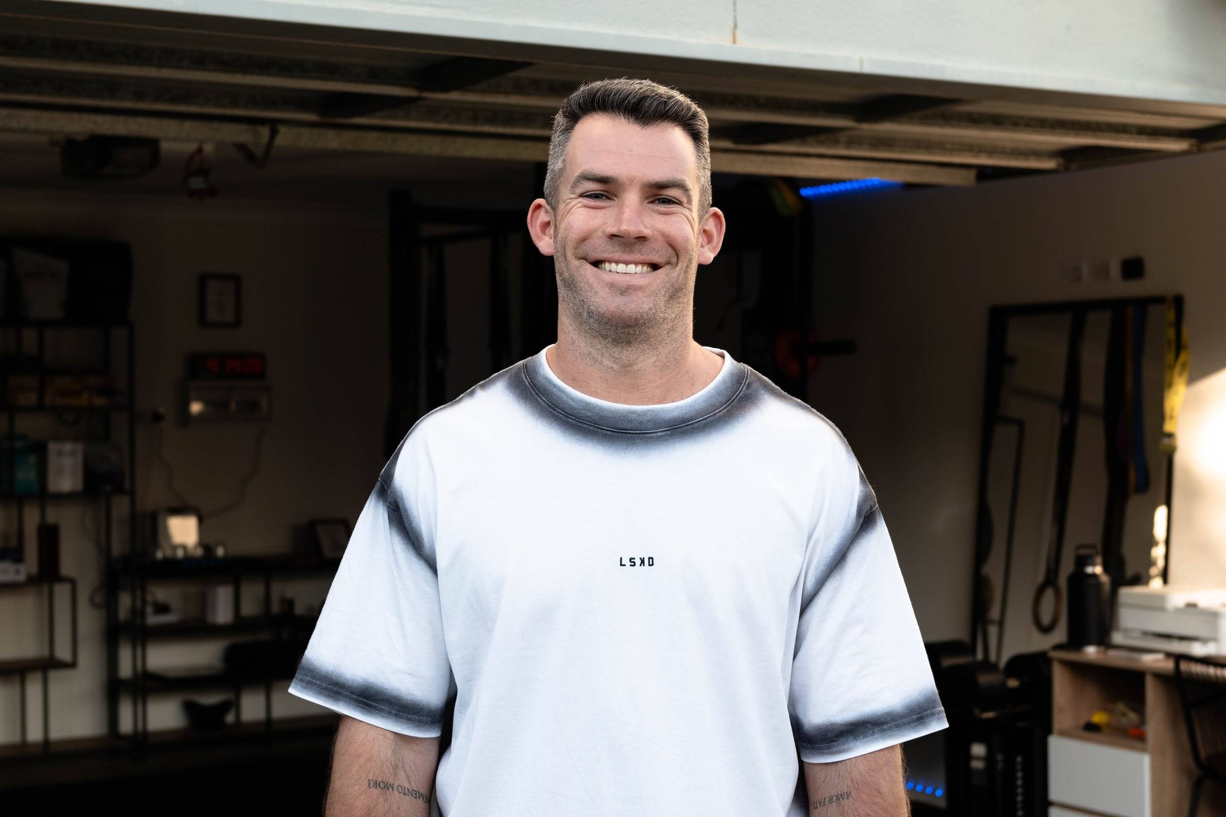 Richy smiling in the True Fit home gym